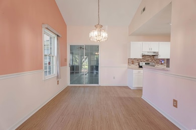 Unfurnished dining area featuring an inviting chan