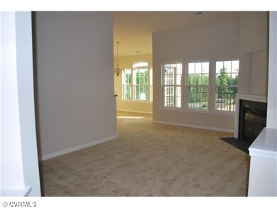 Living Room - Features vaulted ceiling, view throu