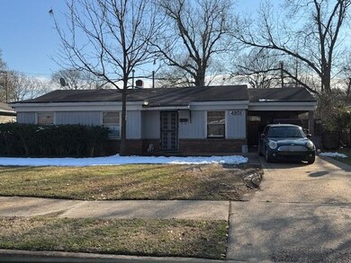 Ranch-style home with a carport and a front lawn