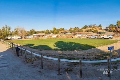 View of community featuring a lawn and a view of rural / pastoral area