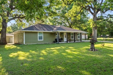 Ranch-style home featuring a front lawn