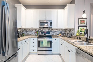Kitchen featuring pendant lighting, white cabinets