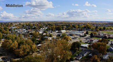 Aerial view of property's location featuring nearby suburban area