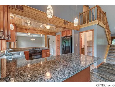 Kitchen. Granite counters and custom cabinets.