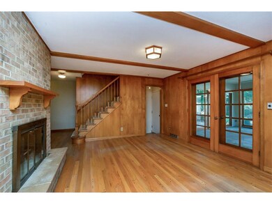 Main level gathering area with fireplace and enclo