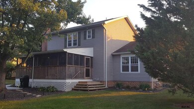 Covered and Screened rear porch overlooking level 