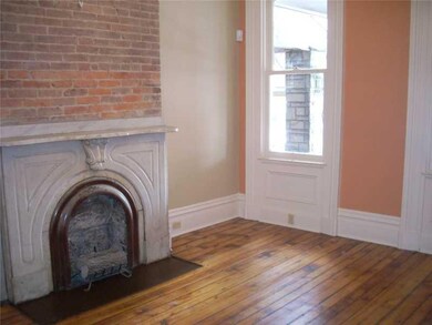 Living Room. Stunning detail, original mantels, re