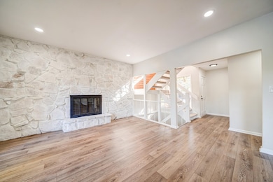 Unfurnished living room featuring light hardwood /