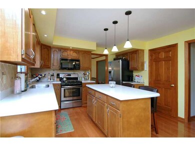 Kitchen. Hardwood floors, neutral dcor colors make