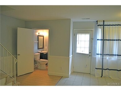 View from Kitchen to half bath which also houses w