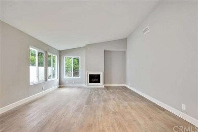Spacious living room with fireplace.
