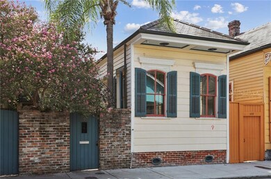 Living room windows open to Barracks St, gate open