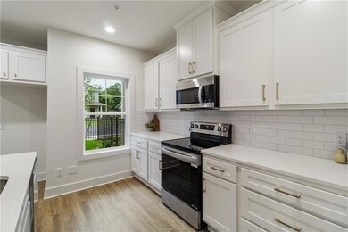 Kitchen with appliances with stainless steel finis