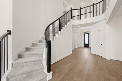 *REPRESENTATIONAL PHOTO* Grand Rounded Staircase With Modern Touches