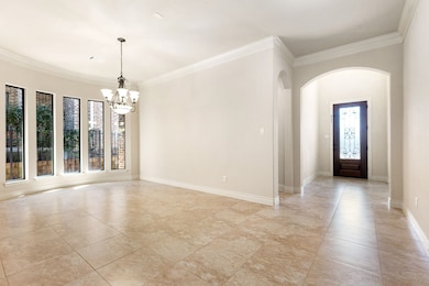 This spacious dining room features large windows f