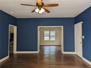 Unfurnished room featuring wood finished floors a