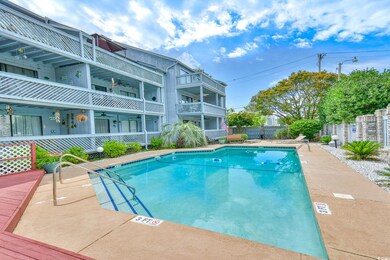 View of pool with ceiling fan