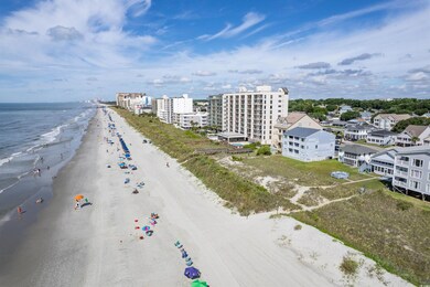 Birds eye view of property with a view of the beac