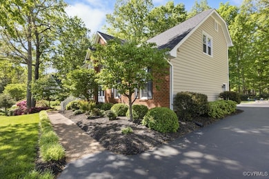 View of side of property featuring brick siding, a