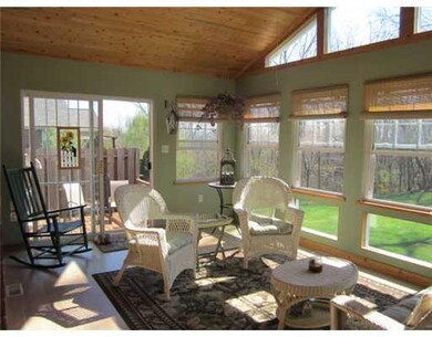 Sunroom. ENJOY THIS BEAUTIFUL 4 SEASON ROOM AS YOU LISTEN TO THE CASCADING WATERFALL IN THE MANICURED REAR YARD. SLIDER DOORS TO MAINTENANCE FREE DECK WITH PRIVACY FENCE.