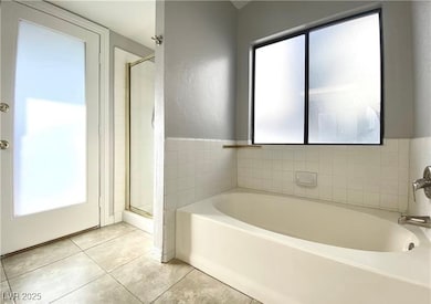 Primary Bathroom with plenty of natural light, a g