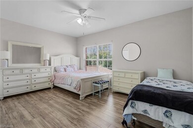 Bedroom featuring wood finished floors and ceiling fan