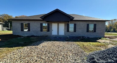 This is actual photo of this duplex. Doors not painted yet or concrete drive poured yet