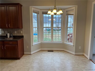 Unfurnished dining area with an inviting chandelie