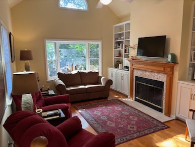 family room with hardwood floors/vaulted ceilings/