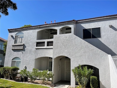 Mediterranean / spanish home featuring stucco siding and a balcony