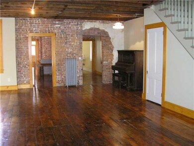 Living Room. Original plank floors gleam in this e