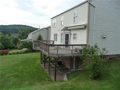Exterior Back. View of the backside of home with a