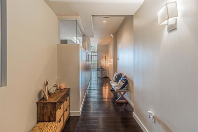 Corridor featuring dark hardwood / wood-style floo