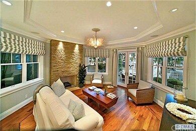 Bayfront formal living room with masonry fireplace