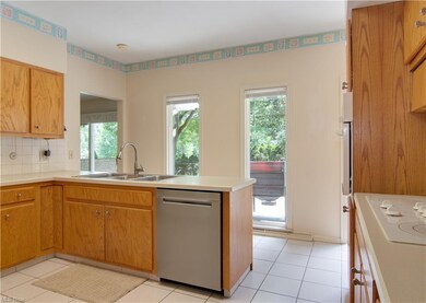 Three basin stainless steel sink and dishwasher.