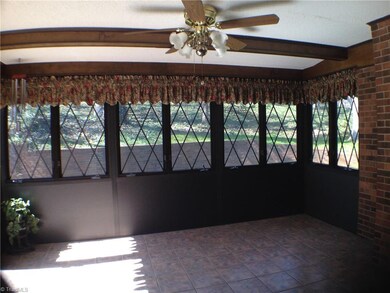 To the left of the sunroom is a door to the patio and backyard