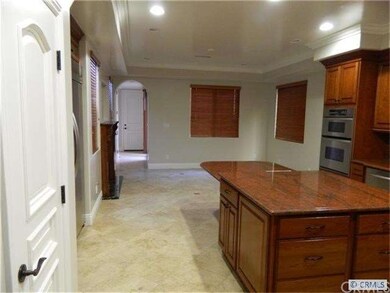 Kitchen view of eating area and fireplace