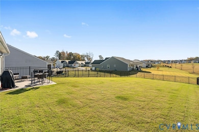 Fenced backyard with a patio and a residential view