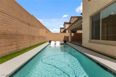 View of swimming pool featuring a fenced backyard