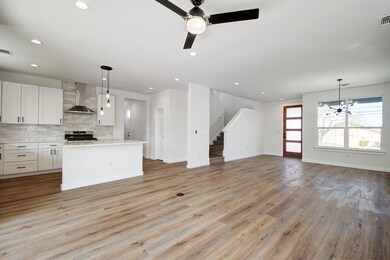 Unfurnished living room featuring baseboards, vis