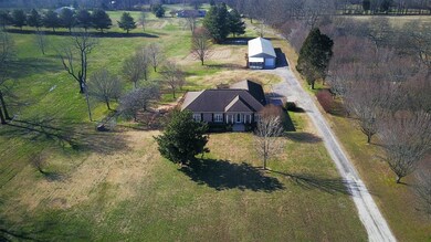 This outstanding property has a beautifully renovated home on more than 5 level acres. It also has two shop/storage buildings connected under one roof. One of the shops has an office and large bonus room!