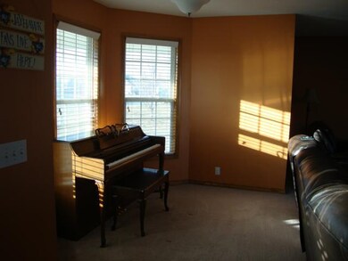 SUNNY PIANO ALCOVE IN ENTRY WAY LEADING TO LIVING 