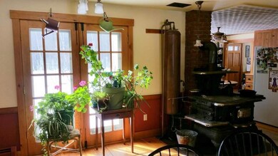 French doors in the dining room lead...