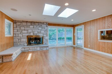 Light filled den with gas fireplace