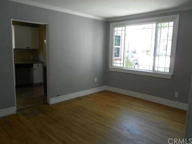Separate dining room with large window.