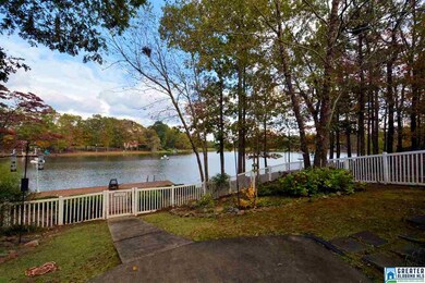Fenced backyard with lake view