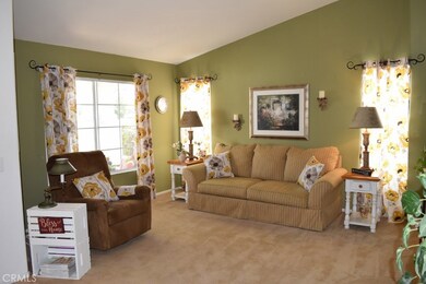 Sunny family room with high vaulted ceilings