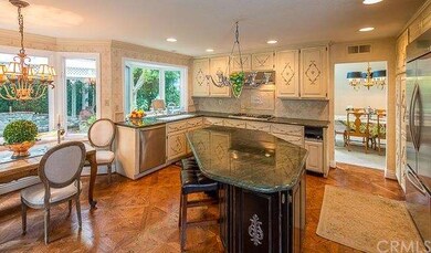 Expansive kitchen with nook overlooking bay window
