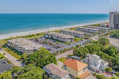 Birds eye view of property with a view of the beac