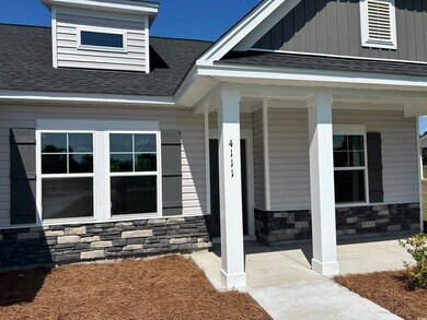 Property entrance with covered porch
